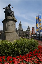 Scotland, Strathclyde, Glasgow, City Centre with James Watt statue and surrounding flowerbeds