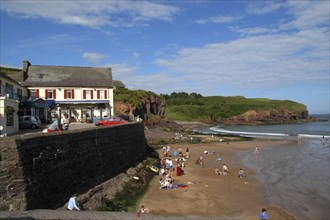 Ireland, General, Seaside scene with sandy beach and The Strand seafood restaurant above