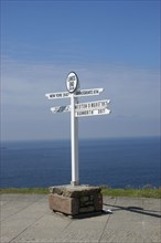 England, Cornwall, Lands End, Sign post detailing distances to John O Groats and New York