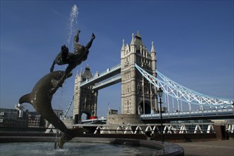 England, London, Tower Bridge with sculpted fountain in the foreground