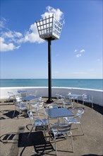England, West Sussex, Bognor Regis, Millennium Beacon on the seafront beside the beach with empty