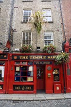 Ireland, County Dublin, Dublin City, Temple Bar traditional Irish public house with cobbled street.