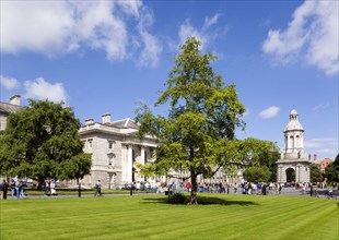 Ireland, County Dublin, Dublin City, Trinity College university with people walking through