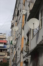 Albania, Tirane, Tirana, Satellite dishes on apartment building.