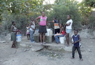 Haiti, La Gonave, Children using water pump provided by the Scottish Charity LemonAid clean water