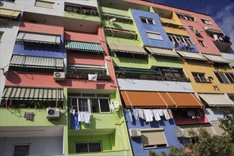 Albania, Tirane, Tirana, Multi coloured exterior facade of apartment block.