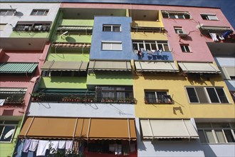 Albania, Tirane, Tirana, Part view of exterior facade of multi coloured apartment block.