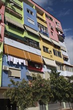 Albania, Tirane, Tirana, Part view of exterior facade of multi coloured apartment block with
