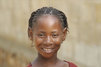 Haiti, La Gonave, Young happy smiling girl.