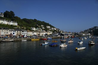 England, Cornwall, Looe, View of moored boats and view along the waterfront