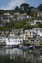 England, Cornwall, Polperro, Waterfront houses seen over the harbour