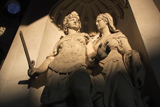 Cropped view of statues partly in shadow in the courtyard of the Hofburg Palace. Photo: Bennett