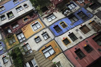 The Hundertwasser-Krawinahaus angled part view of exterior facade of apartment building. Photo :