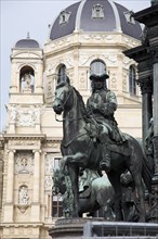 Equestrian statue on Maria Therisia Platz with the Natural History Museum in the background. Photo