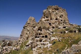 Uchisar Castle. Huge volcanic rock outcrop riddled with tunnels and dovecote windows. Photo: Hugh
