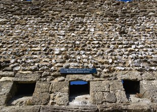 Portchester Castle Norman 12th Century flint walls with the garderobe chutes or toilets from the