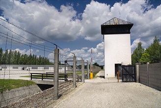 Dachau World War II Nazi Concentration Camp Memorial Site. Barbed wire fence with watch tower and