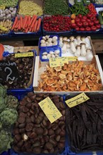 Vegetable stall in the Naschmarkt. Cropped view of display of produce including mushrooms hazelnuts