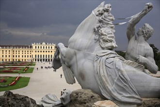 Detail from the Neptune Fountain with the Schonnbrunn Palace in the background. Photo : Bennett