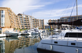 Port Solent with boats moored in the Marina surrounded by apartment buildings. Photo: Paul Seheult