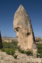 Sword Valley rock formation with hilltop town of Uchisar in distance behind. The valley got its