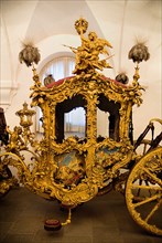 Nymphenburg Palace Marstall Museum. Highly ornate gold and painted coach made for the coronation of