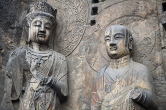 Carved Buddhist statues Fengxian Temple Tang Dynasty Longmen Grottoes and Caves. Photo : Mel