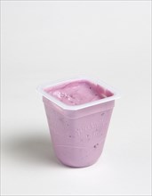 Yeo Valley probiotic blueberry fruit yogurt pot against a white background. Photo: Paul Seheult
