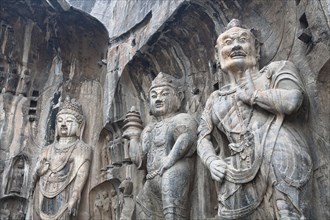 Carved Buddhist statues Fengxian Temple Tang Dynasty Longmen Grottoes and Caves. Photo: Mel