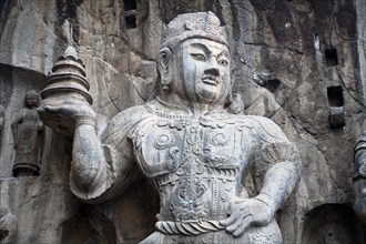Carved statue Fengxian Temple Tang Dynasty Longmen Grottoes and Caves. Photo : Mel Longhurst
