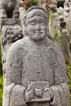 Carved statue of a man in Small Goose Pagoda Park. Photo : Mel Longhurst