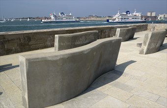Seats on the Millenium Walk with Isle Of Wight ferries and yachts passing through the harbour
