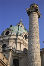 Karlskirche or Church of St Charles Borromeo. Part view of exterior with ellipsoid dome and column.