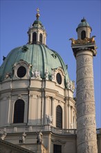 Karlskirche or Church of St Charles Borromeo. Part view of exterior with ellipsoid dome and column.