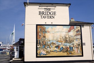 The Camber in Old Portsmouth showing The Spinnaker Tower behind the Bridge Tavern with a mural of