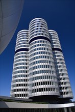 BMW Headquarters exterior with the BMW Tower which stands 101 metres tall and mimics the shape of