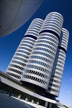 BMW Headquarters exterior. Angled view of the BMW Tower which stands 101 metres tall and mimics the