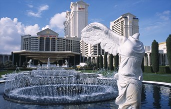 USA, Nevada, Las Vegas, Caesars Palace hotel and casino with headless statue in the foreground.