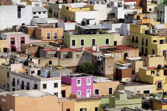 Mexico, Bajio, Zacatecas, Looking across flat rooftops of colourful houses from viewpoint at Cerro