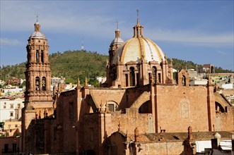 Mexico, Bajio, Zacatecas, The Cathedral exterior with domed roof and bell towers. 
Photo : Nick