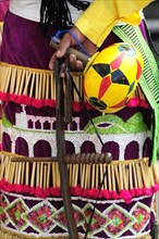 Mexico, Bajio, Zacatecas, Indigenous dance group detail of dress and musical instrument. 
Photo :