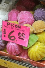 Mexico, Puebla, Markets, Coloured sweets for sale. 
Photo : Nick Bonetti