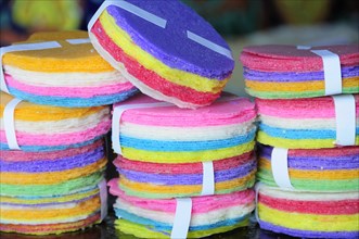 Mexico, Puebla, Markets, Coloured rice paper snacks. 
Photo : Nick Bonetti
