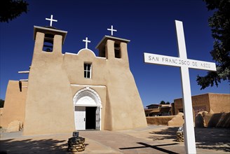 USA, New Mexico, Taos, Church of San Francisco de Asis. Adobe style church exterior with name on