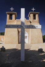 USA, New Mexico, Taos, Church of San Francisco de Asis. Adobe style church exterior with name on