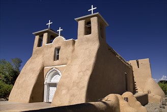 USA, New Mexico, Taos, Church of San Francisco de Asis. Angled view of adobe style exterior facade