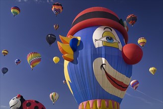 USA, New Mexico, Albuquerque, Annual balloon fiesta colourful hot air balloons in flight. Balloon