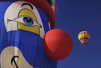 USA, New Mexico, Albuquerque, Annual balloon fiesta colourful hot air balloons in flight. Part view