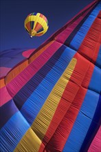 USA, New Mexico, Albuquerque, Annual balloon fiesta colourful hot air balloons in flight. Part view