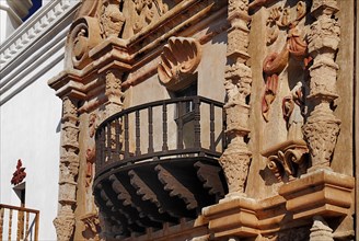 USA, Arizona, Tucson, Mission Church of San Xavier del Bac. Detail of balcony and carved window